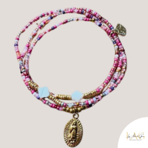 Multi-strand pink pastel beaded wrap bracelet with a gold Virgin Mary pendant.